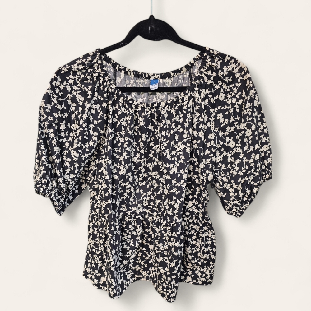 Ladies Blouse, peplum with puff sleeve and back cutout.